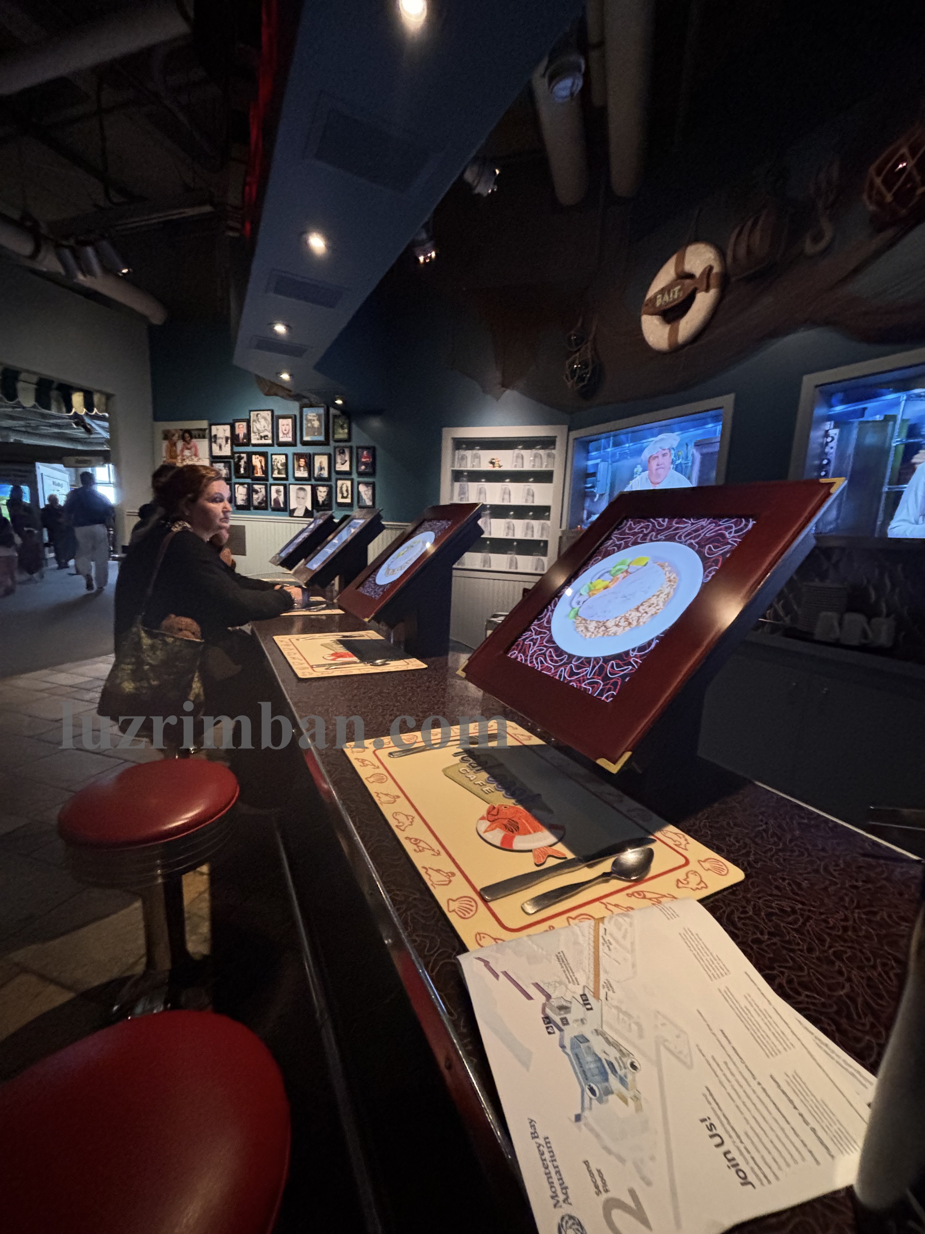 The "Seafood bar" at the Monterey Bay Aquarium invites guests to sit and try ordering seafood and learn about sustainable seafood consumption. Photo by Luz Rimban